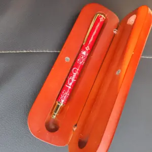 Pen is of metal and case is lasani wood