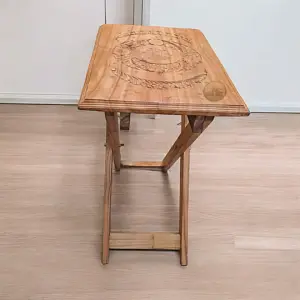 table with brass work and carving